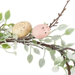 Deko-Kranz Osterzeit, Ø 28cm, mit vanillegelben und roséfarbenen Eiern und weißen Blüten