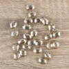 Perlen, oval, flach, 0,9cm x 1,2cm, facettiert, transparent, taupe, 25 Stück
