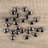 Perlen, oval, flach, 0,9cm x 1,2cm, facettiert, transparent, anthrazit, 25 Stück