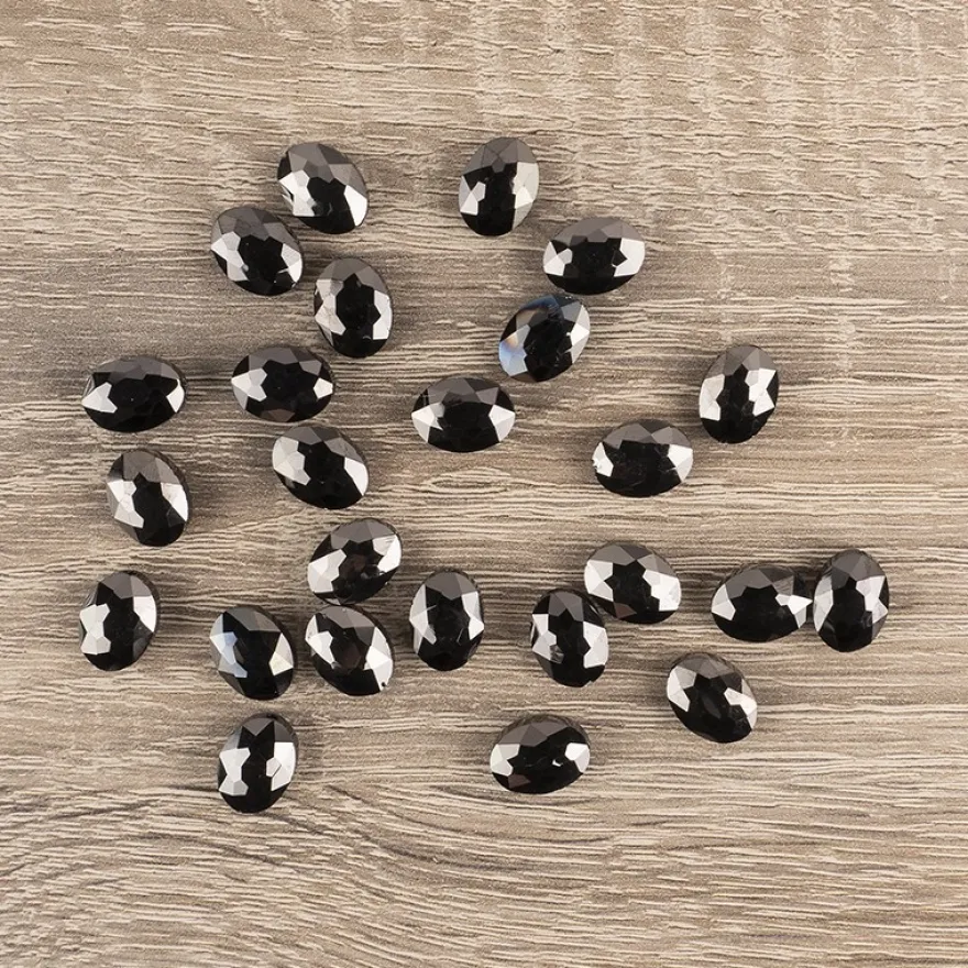 Perlen, oval, flach, 0,9cm x 1,2cm, facettiert, transparent, anthrazit, 25 Stück