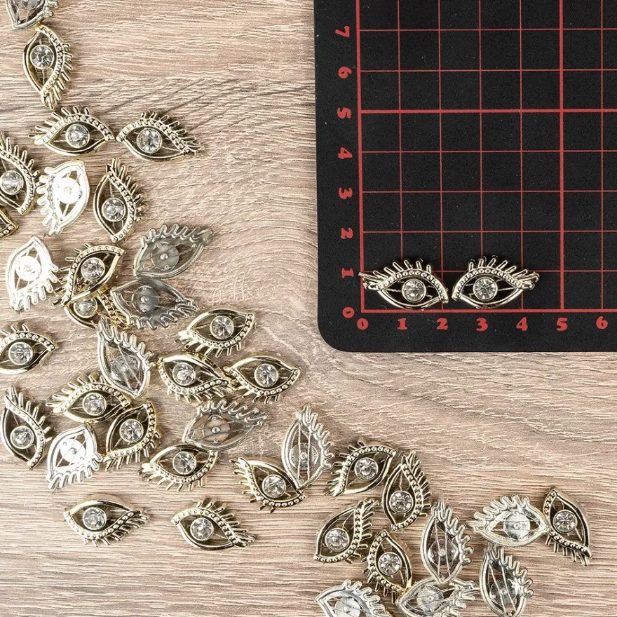 Premium-Schmucksteine, Augenpaar, 2,2cm x 1,4cm x 0,4cm, hellgold, mit Glaskristallen, 40 Stück